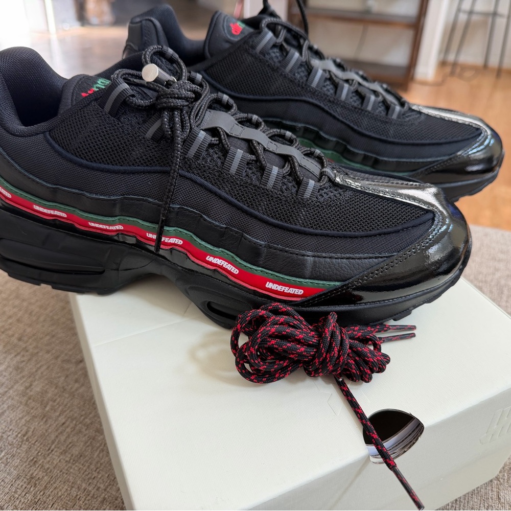 Undefeated Black and Red Sneakers